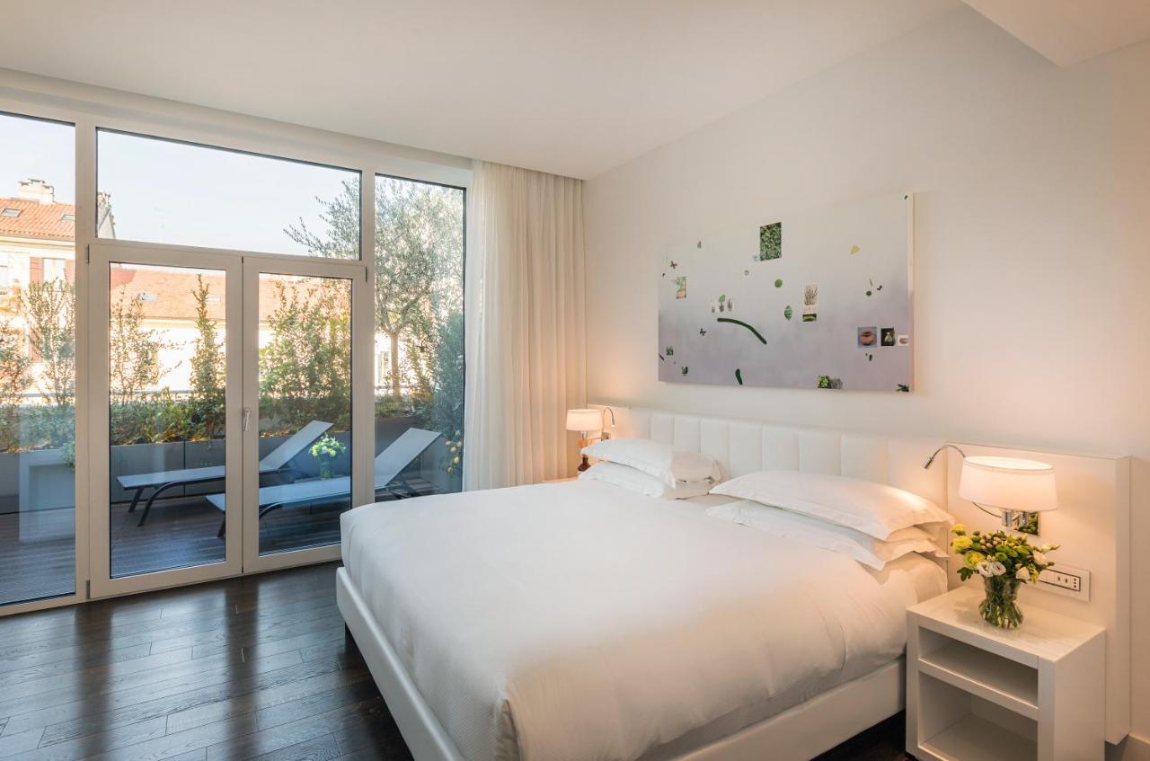มัญญา ปาร์ โลเตล อา ปาร์ฟูม Hotel มิลาน ภายนอก รูปภาพ Deluxe room